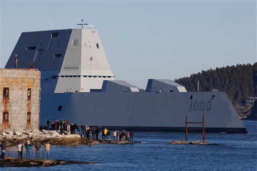 The first Zumwalt-class destroyer, USS Zumwalt, the largest ever built for the U.S. Navy, passes spectators at Fort Popham at the mouth of the Kennebec River in Phibbsburg, Maine, Monday, Dec. 7, 2015, in Bath, Maine. (AP Photo/Robert F. Bukaty)