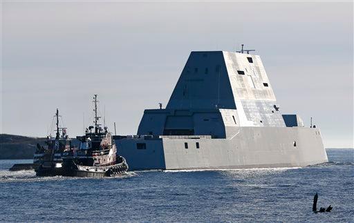 The first Zumwalt-class destroyer, the USS Zumwalt , the largest ever built for the U.S. Navy, leaves the Kennebec River, Monday, Dec. 7, 2015, in Phippsburg, Maine. (AP Photo/Robert F. Bukaty)