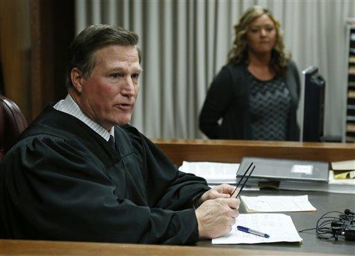 Judge Timothy Henderson talks to the jury as the verdict is returned in the trial of Daniel Holtzclaw in Oklahoma City, Thursday, Dec. 10, 2015. Holtzclaw, a former Oklahoma City police officer, was facing dozens of charges alleging he sexually assaulted 13 women while on duty. Holtzclaw was found guilty on a number of counts. (AP Photo/Sue Ogrocki, Pool)