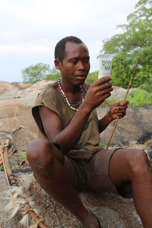 A Hadza hunter-gatherer studies the ingredient label on Human Food Bar, a product co-created by Jeff Leach of the Human Food Project. (www.humanfoodbar.com)