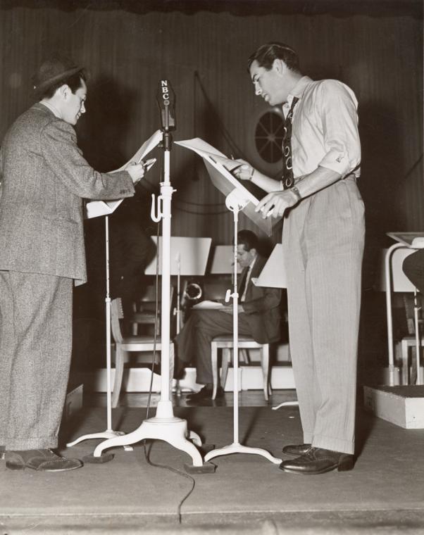 Robert Taylor (R) and unidentified actor rehears for an episode of NBC's radio program Good News of 1938. (NYPL)