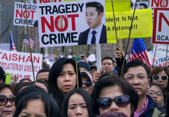 Protesters at a rally in the Brooklyn borough of New York Saturday in support of a former NYPD police officer Peter Liang on Feb. 20, 2016. (AP Photo/Craig Ruttle)