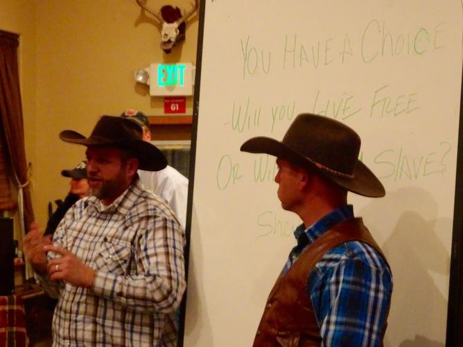 Occupiers Ammon and Ryan Bundy ask Harney County Ranchers whether they will "live free or be a slave?" just before imploring Harney County ranchers to break their BLM grazing leases, in Crane, Ore., on Jan. 18, 2016. (Peter Walker)