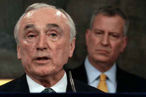 New York City Police Commissioner William Bratton, left, speaks during a news conference in New York's City Hall, as New York Mayor Bill de Blasio listens on Jan. 12, 2016. (Richard Drew/AP)