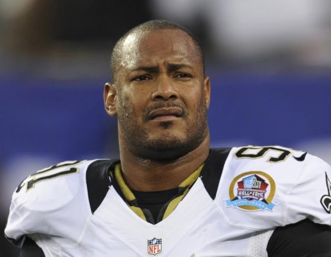 New Orleans Saints defensive end Will Smith appears before an NFL football game against the New York Giants in East Rutherford, N.J., on  Dec. 9, 2012. (AP Photo/Bill Kostroun, File)