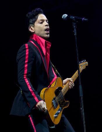 In this Nov. 14, 2010 file photo, musician Prince performs in Yas Island, on the final night of the F1 motor race meeting in Abu Dhabi, United Arab Emirates. (AP Photo/Nousha Salimi, File)