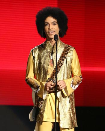 Prince presents the award for favorite album - soul/R&B at the American Music Awards at the Microsoft Theater on Nov. 22, 2015, in Los Angeles. (Matt Sayles/Invision/AP)