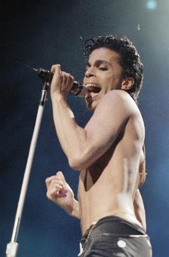 Prince performs in concert in this August 2, 1986 file photo. (AP File Photo/Mario Suriani)