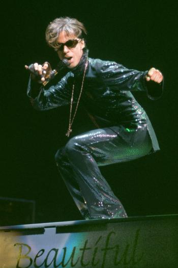 The Artist formerly known as Prince, performs at the Festhalle in Frankfurt, Germany, on Dec. 22, 1998, during the first of three concerts in Germany as part of his "New Power Soul" tour. (AP Photo/Bernd Kammerer)