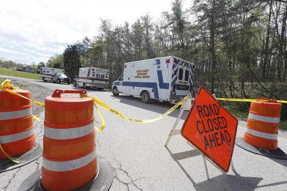 Law enforcement has closed down Union Hill Road in Pike County, Ohio, while they investigate a shooting with multiple fatalities on Friday, April 22, 2016. Authorities say multiple people have been shot to death in rural Ohio, some 70 miles east of Cincinnati. (Chris Russell/The Columbus Dispatch via AP)