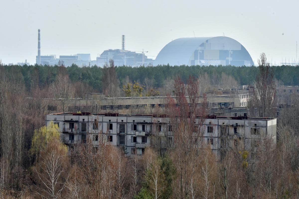 The picture shows a general view to Chernobyl Nuclear Power Plant from ghost city of Prypyat on April 8, 2016. (SERGEI SUPINSKY/AFP/Getty Images)