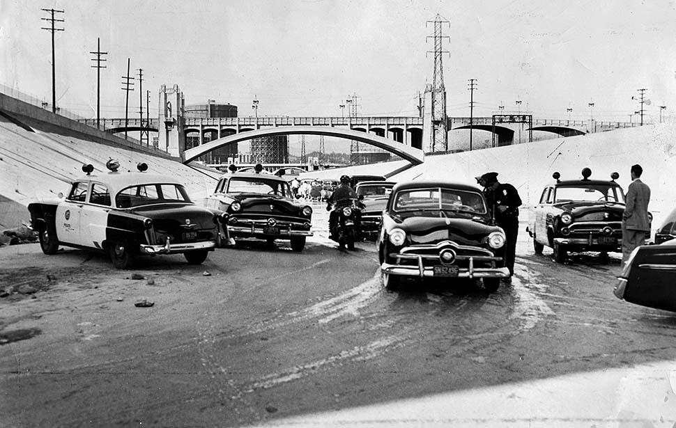 In 1955, the Los Angeles Police rounded up 150 youths for drag racing on the LA River bed. (Julian Robinson/The Los Angeles Times)