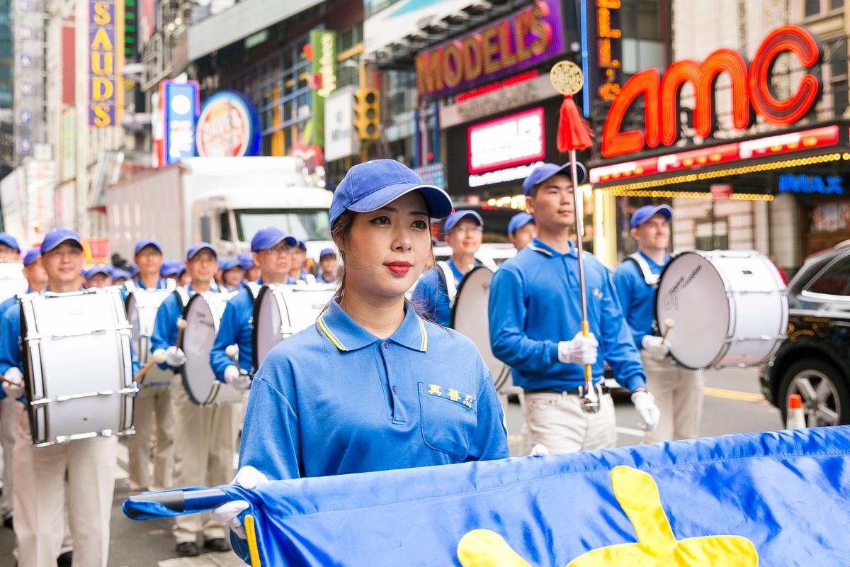 The Tian Guo Marching Band performs in the World Falun Dafa Day Day parade along 42nd Street in New York, on May 13, 2016. (Samira Bouaou/Epoch Times)