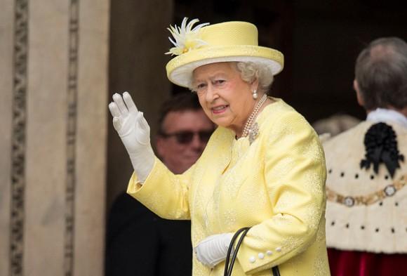 Queen Elizabeth II waves as she attends a National Service of Thanksgiving as part of her 90th birthday celebrations at St Paul's Cathedral on June 10, 2016, in London. (Mark Cuthbert/UK Press via Getty Images)