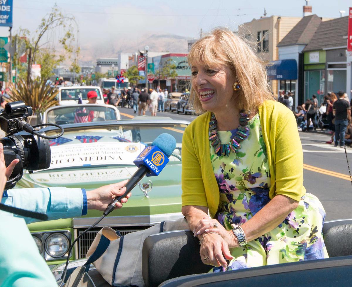 Congresswoman Jackie Speier is interviewed by NTDTV during the 76th annual Posy Parade in San Bruno, Calif., on June 5. (Gary Wang/Epoch Times)