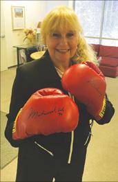 <br/>Lina wearing boxing gloves autographed by Ali. (Courtesy of Donna Katto)