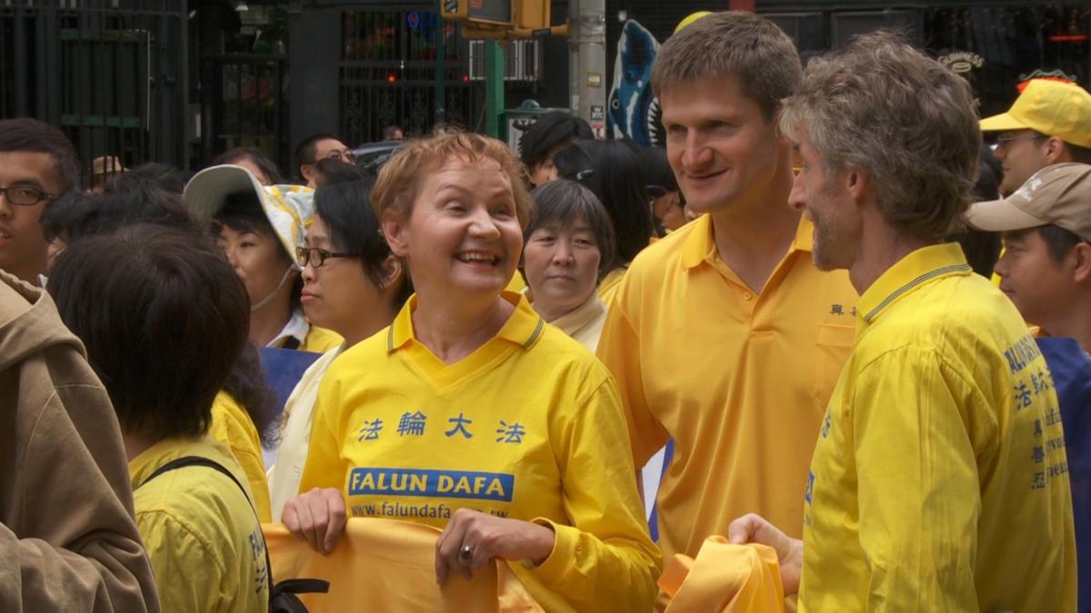 Barbara Schafer joins a Falun Gong parade with other practitioners in New York City. (Photo by Oliver Trey)