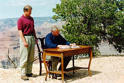 President Bill Clinton signs a proclamation creating the Grand Staircase-Escalante National Monument in Utah, 1996. Because the act was unpopular with Utah politicians, the signing ceremony was held at the Grand Canyon in Arizona. (<a href="http://1.usa.gov/290LIaV">National Archives and Records Administration</a>)