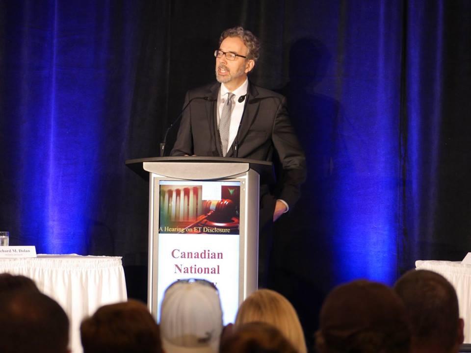 Richard Dolan, a researcher of unidentified aerial phenomena (UAP), speaks at a UAP disclosure hearing in Brantford, Canada, on June 25, 2016. (Courtesy of Zland Communications)
