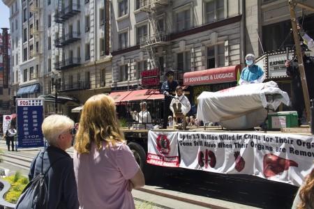 Actors hold an anti-persecution demonstration on a float in the parade in San Francisco on July 16. (Epoch Times)