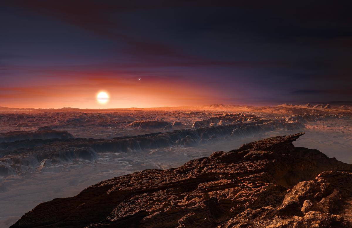 This artist's impression shows a view of the surface of the planet Proxima b orbiting the red dwarf star Proxima Centauri, the closest star to the Solar System. (ESO/M. Kornmesser)