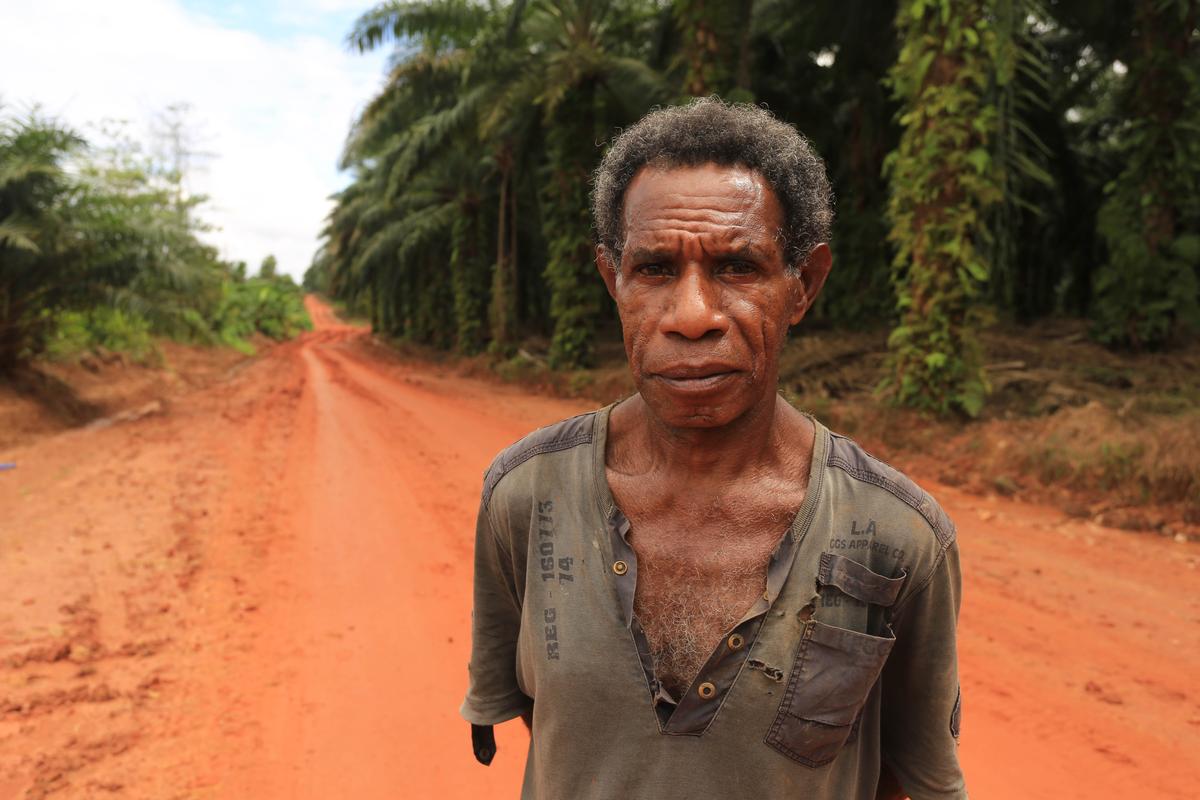 A file photo of an indigenous man, who is part of a community occupying the forest land on the edge of Korindo's PT Tunas Sawa Erma plantation in Papua, Indonesia. (Mighty)