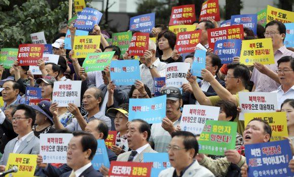 South Korean shout slogans during a rally denouncing North Korea's latest nuclear test in Seoul, South Korea, Sept. 12, 2016. (AP Photo/Lee Jin-man)
