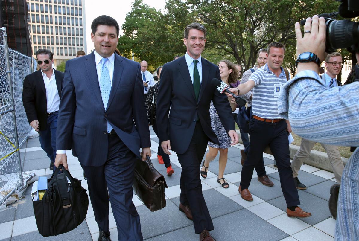 Bill Baroni (C) New Jersey Gov. Chris Christie's former top appointee at the Port Authority of New York and New Jersey, and his attorney Michael Baldassare, (center L) leave Federal Court after a hearing for jury selection in Newark, N.J., on Sept. 13, 2016. (AP Photo/Mel Evans)
