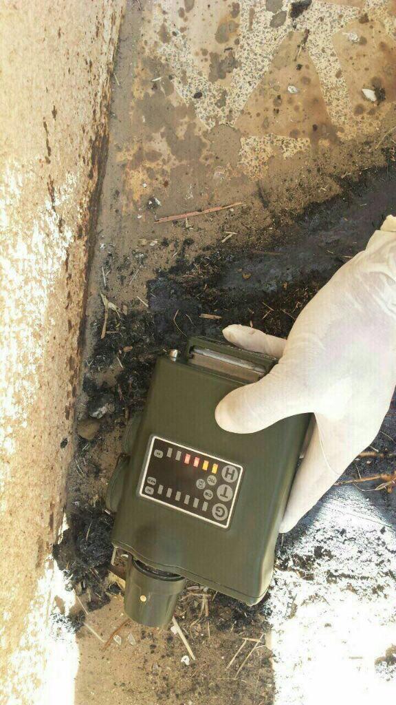 A device used to detect harmful chemicals shows a positive reading for a blister agent near an ISIS weapons cache captured in Qayyarah, Iraq. (BLACKOPS Cyber)