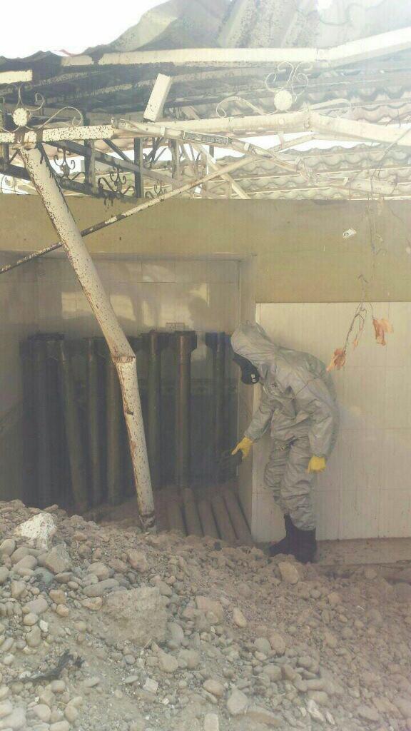 A man in a protective suit investigates a chemical weapons cache, captured in mid-October from ISIS in Qayyarah, Iraq. (BLACKOPS Cyber)