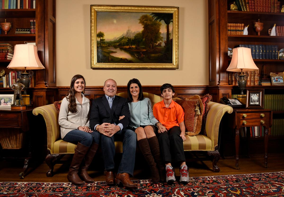 South Carolina Gov. Nikki Haley along with her family, husband Michael, daughter Rena, and son Nalin sit for a portrait in the drawing room of the Governor's Mansion, in Columbia, S.C., in this file photo. (AP Photo/Richard Shiro)