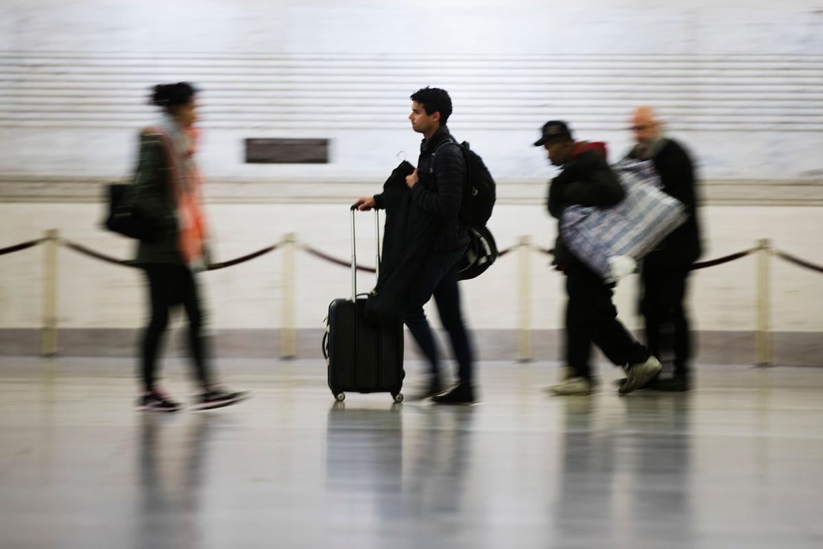 Travelers make their way through the 30th Street Station ahead of the Thanksgiving Day holiday, in Philadelphia on Nov. 22, 2016. (AP Photo/Matt Rourke)