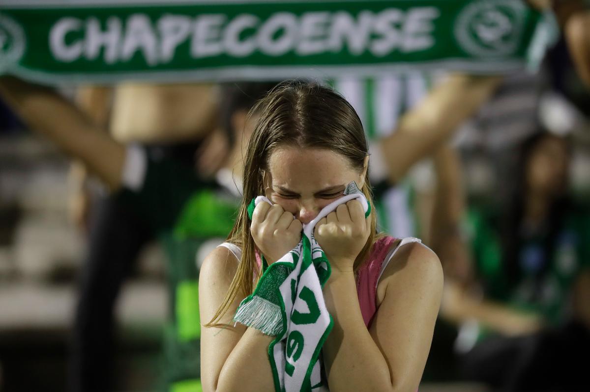 A fan of Brazil's soccer team Chapecoense mourns during a gathering inside Arena Conda stadium in Chapeco, Brazil, on Nov. 29, 2016. (AP Photo/Andre Penner)