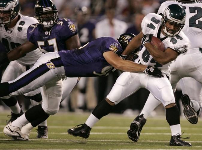 In this Aug. 17, 2006, file photo, Philadelphia Eagles running back Reno Mahe, right, pulls away from a tackle (AP Photo/Chris Gardner, File)