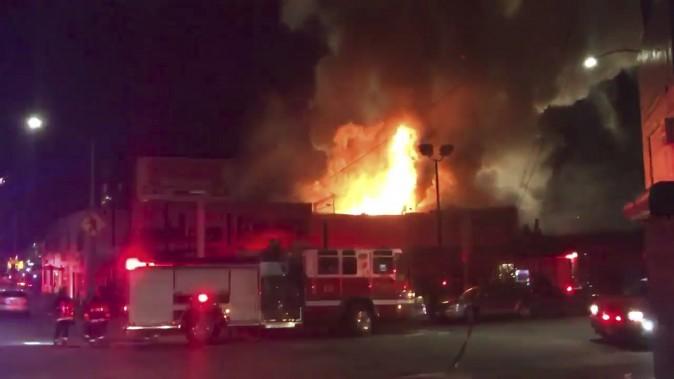 This photo of the Ghost Ship Arts Collective warehouse in Oakland from video provided by @Oaklandfirelive shows the scene of a fire in Oakland on Dec. 3, 2016. (@Oaklandfirelive via AP)