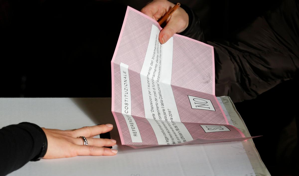 A ballot is being cast at a polling station in Pontassieve, Italy, on Dec. 4, 2016. (AP Photo/Antonio Calanni)