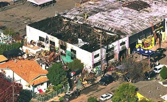 The Ghost Ship Warehouse after a fire that started late Friday swept through the Oakland, Calif., building. (KGO-TV via AP)