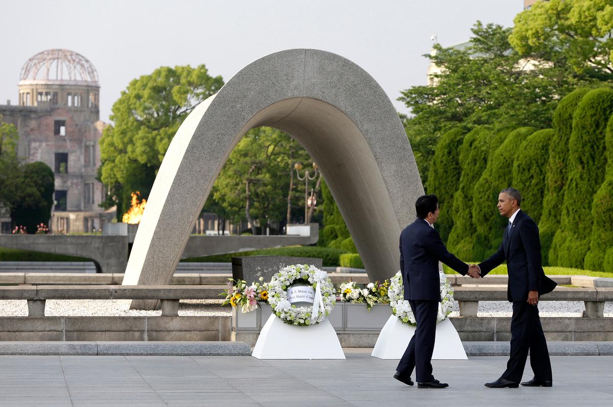 U.S. President Barack Obama (R) shakes hands with Japanese Prime Minister Shinzo Abe at Hiroshima Peace Memorial Park in Hiroshima, western Japan, as Obama became the first sitting U.S. president to visit the site of the world's first atomic bomb attack on May 27, 2016. (AP Photo/Carolyn Kaster, File)