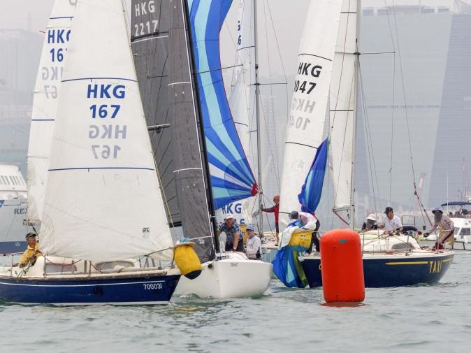 Boats congested at the leeward pin during the RHKYC Lipton Trophy in Victoria Harbour on Saturday Dec 3, 2016. (RHKYC/Guy Nowell)