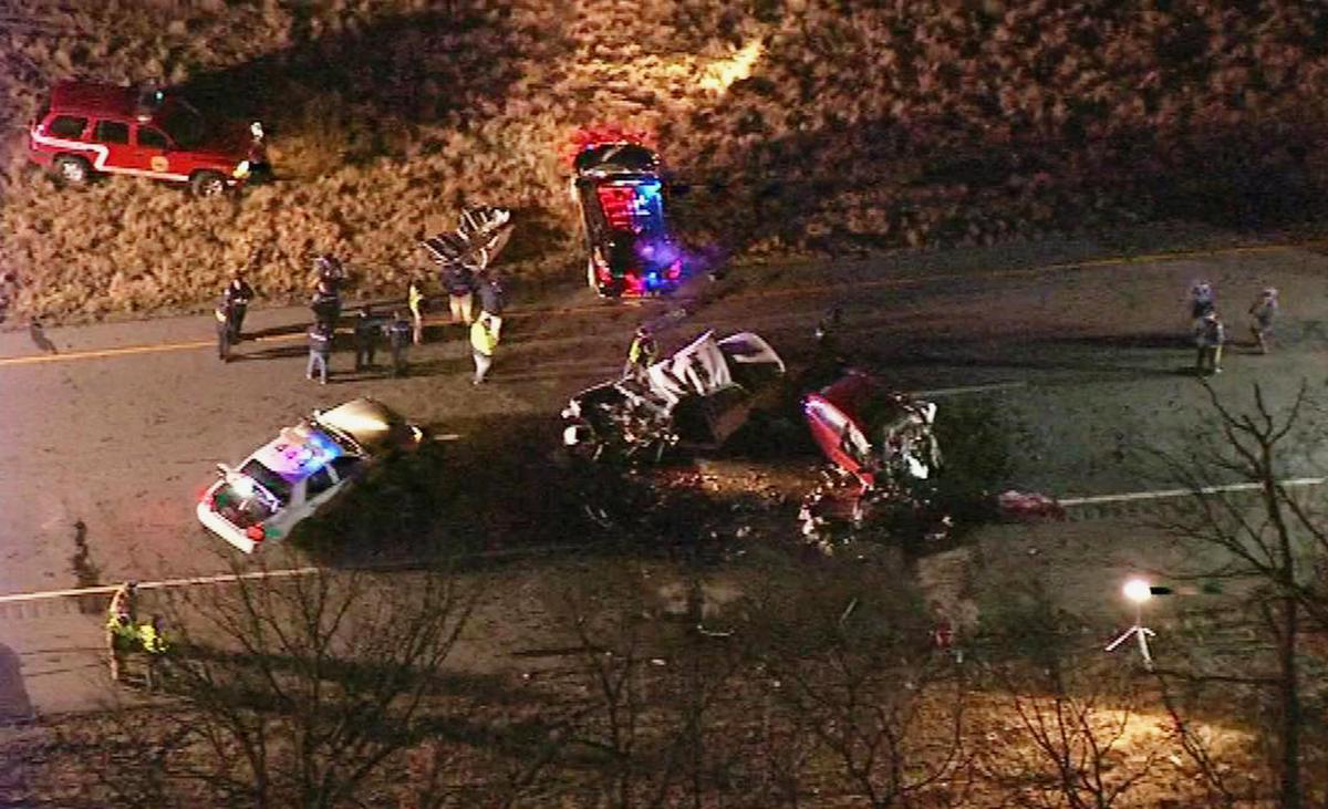 New Jersey State Troopers and police officers work the scene of a crash in Millville, N.J., on Dec. 5, 2016. (WPVI-TV via AP)