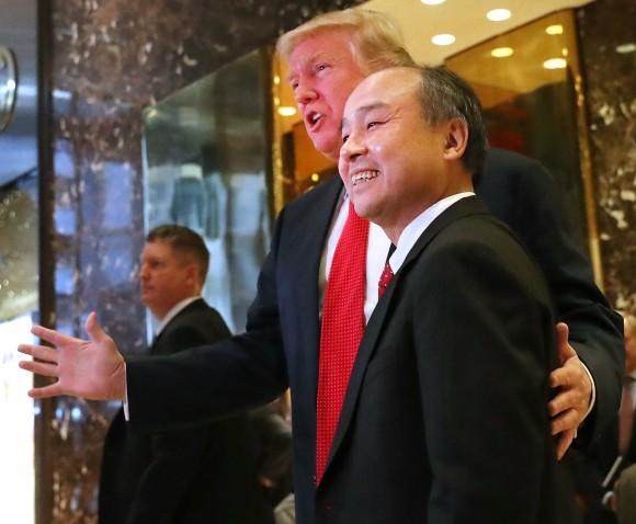President-elect Donald Trump pauses with Masayoshi Son, the chief executive of SoftBank, at Trump Tower in New York City on Dec. 6, 2016. Trump announced that SoftBank has agreed to invest $50 billion in the United States and create 50,000 new jobs. (Spencer Platt/Getty Images)