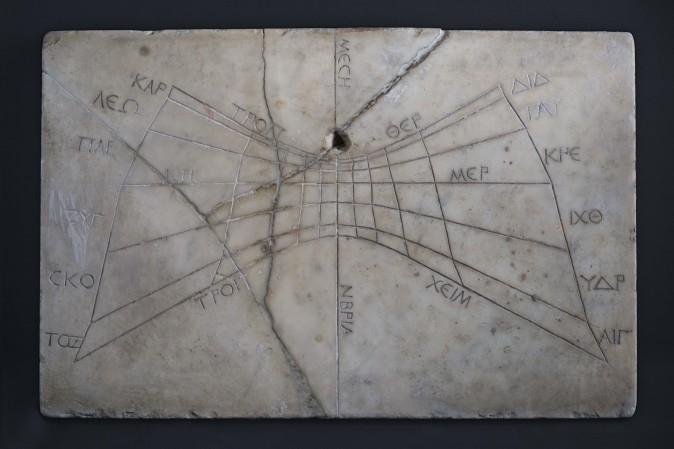 Horizontal sundial with Greek inscriptions, before A.D. 79, Pompeii. Marble, 21 inches by 13 and 1/2 inches by 1 inch. Museo Archeologico Nazionale di Napoli. (Guido Petruccioli/Institute for the Study of the Ancient World)