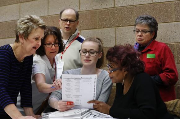 A challenge is reviewed on a ballot during a statewide presidential election recount in Waterford Township, Mich. on Dec. 5, 2016. The recount comes at the request of Green Party candidate Jill Stein who also requested recounts in Pennsylvania and Wisconsin. (AP Photo/Paul Sancya)