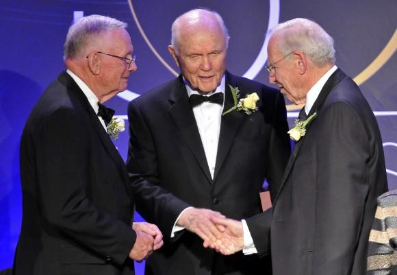 In this Friday, Aug. 29, 2008 file photo, astronauts Neil Armstrong, left, the first man to walk on the moon, John Glenn Jr., center, the first American to orbit earth, and James Lovell, right, commander of Apollo 13, stand at a gathering of 19 of the astronauts who call Ohio home in Cleveland. The gathering of Ohio astronauts was part of NASA's 50th Anniversary celebration. Glenn died Thursday, Dec. 8, 2016, at the age of 95. (AP Photo/Jason Miller, File)