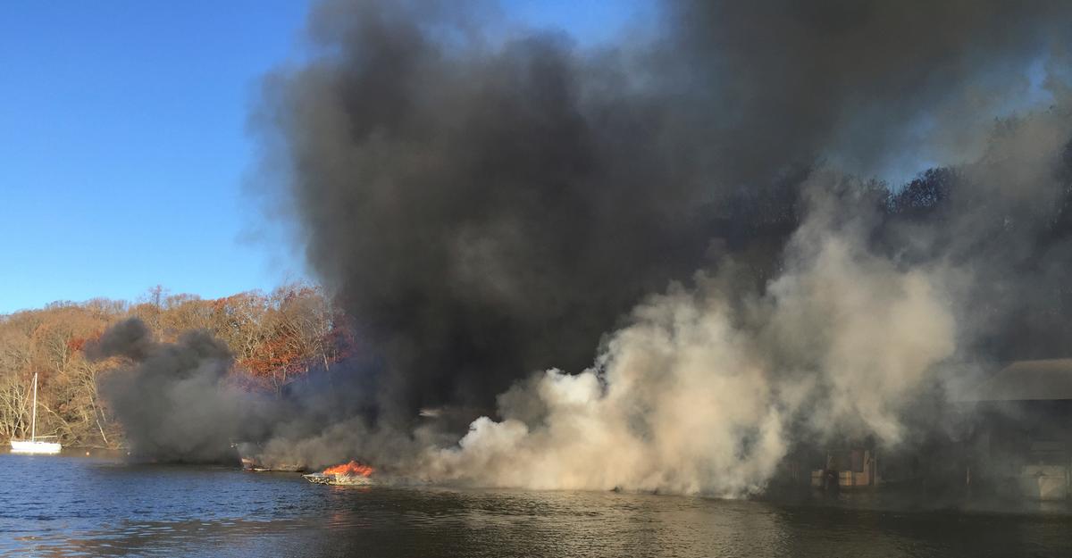 A burning marina on the James River in Richmond, Va., on Dec. 9, 2016. (Mike Ostrander via AP)