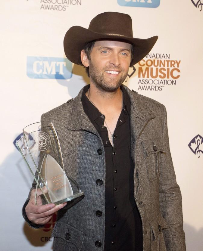 Dean Brody wins the award for Album of the Year during the Canadian Country Music Association awards in Edmonton, Alberta on Sunday, Sept 7, 2014. THE CANADIAN PRESS/Jason Franson