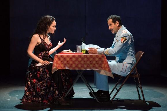 Café owner Dina (Katrina Lenk) and Col. Tewfiq Zakaria (Tony Shalhoub) discover they have a good deal in common. (Ahron Foster)
