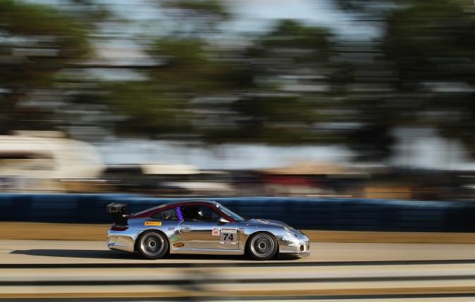 The #74 2009 Porsche 997.2 Cup car of John and Paul Reisman sweeps towards Turn Six. (Chris Jasurek/Epoch Times)