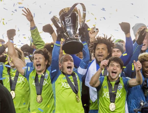 Seattle Sounders players celebrate after winning MLS Cup over Toronto FC in a sudden-death penalty shootout in Toronto on Dec. 10, 2016. (The Canadian Press/Frank Gunn)