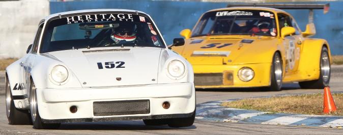 Yves Scemama in the Group F #152 1974 Porsche 911 RSR/IROC leads the eventual class winner, the #51 1974 Porsche 911 RSR of Kevin Wheeler, Hartmut Von Seelen, and Jonathon Ziegelman. (Chris Jasurek/Epoch Times)